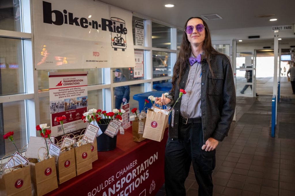 A transit employee receives a treat bag, with thanks for his service.