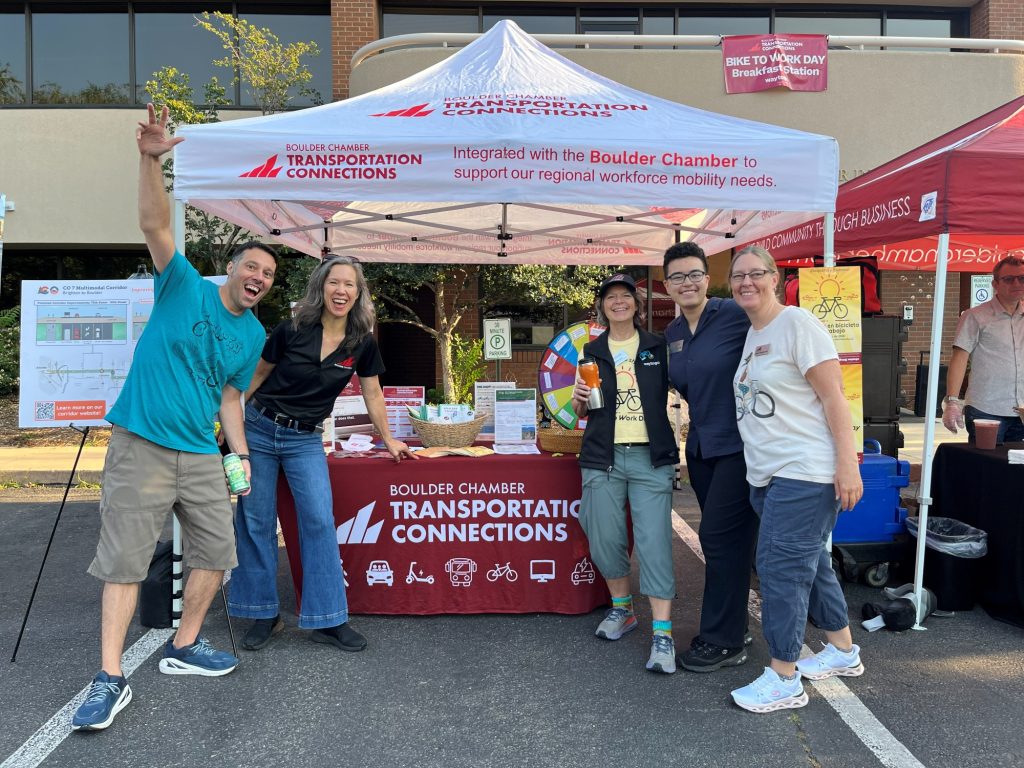 The BCTC team poses by their Bike to Work Day breakfast station table