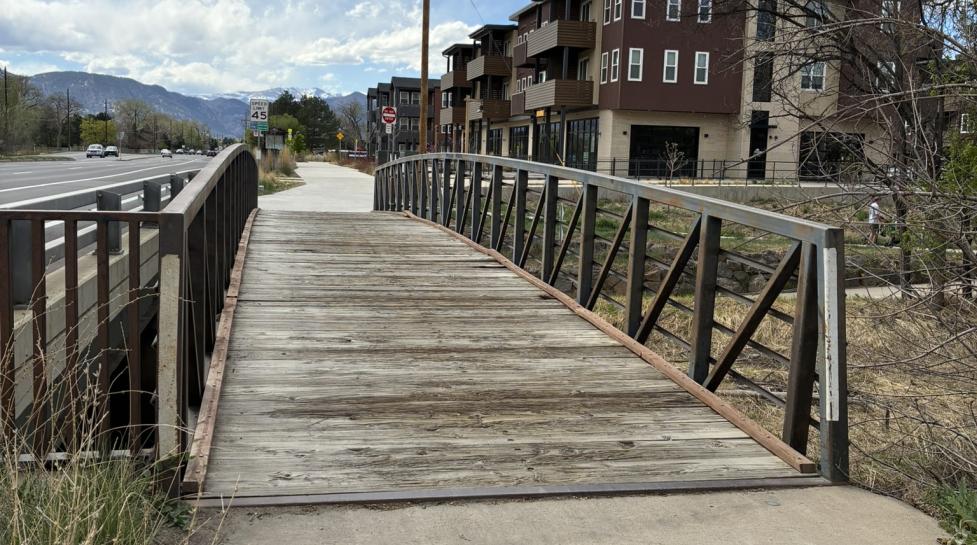 An image of the pedestrian bridge on the north side of Arapahoe spanning South Boulder Creek.